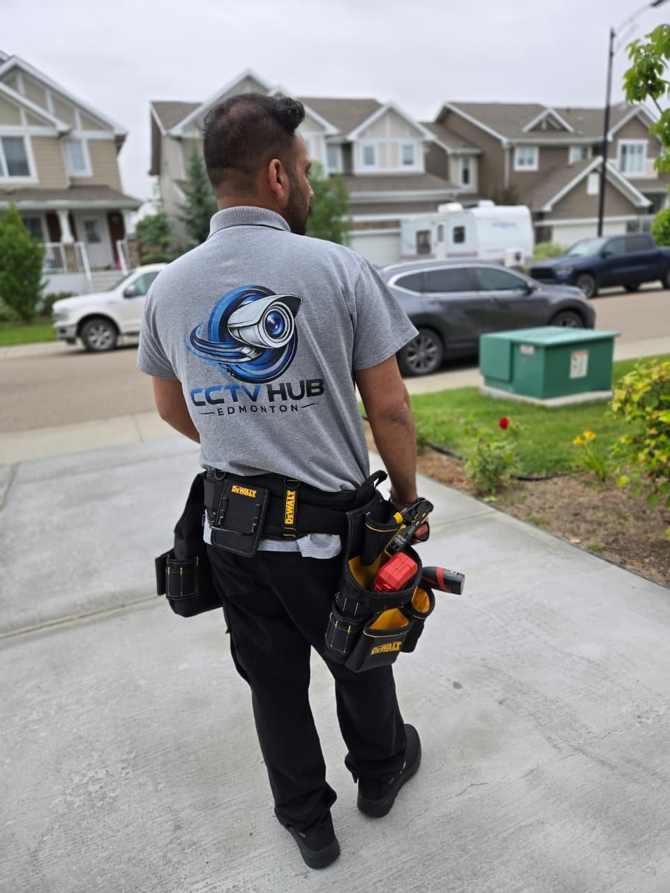 CCTV Hub Edmonton technician heading to a residential install with tool belt